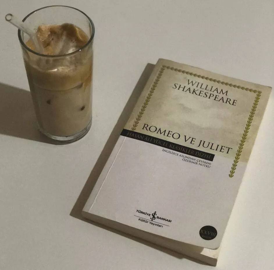 a glass of iced coffee beside a book